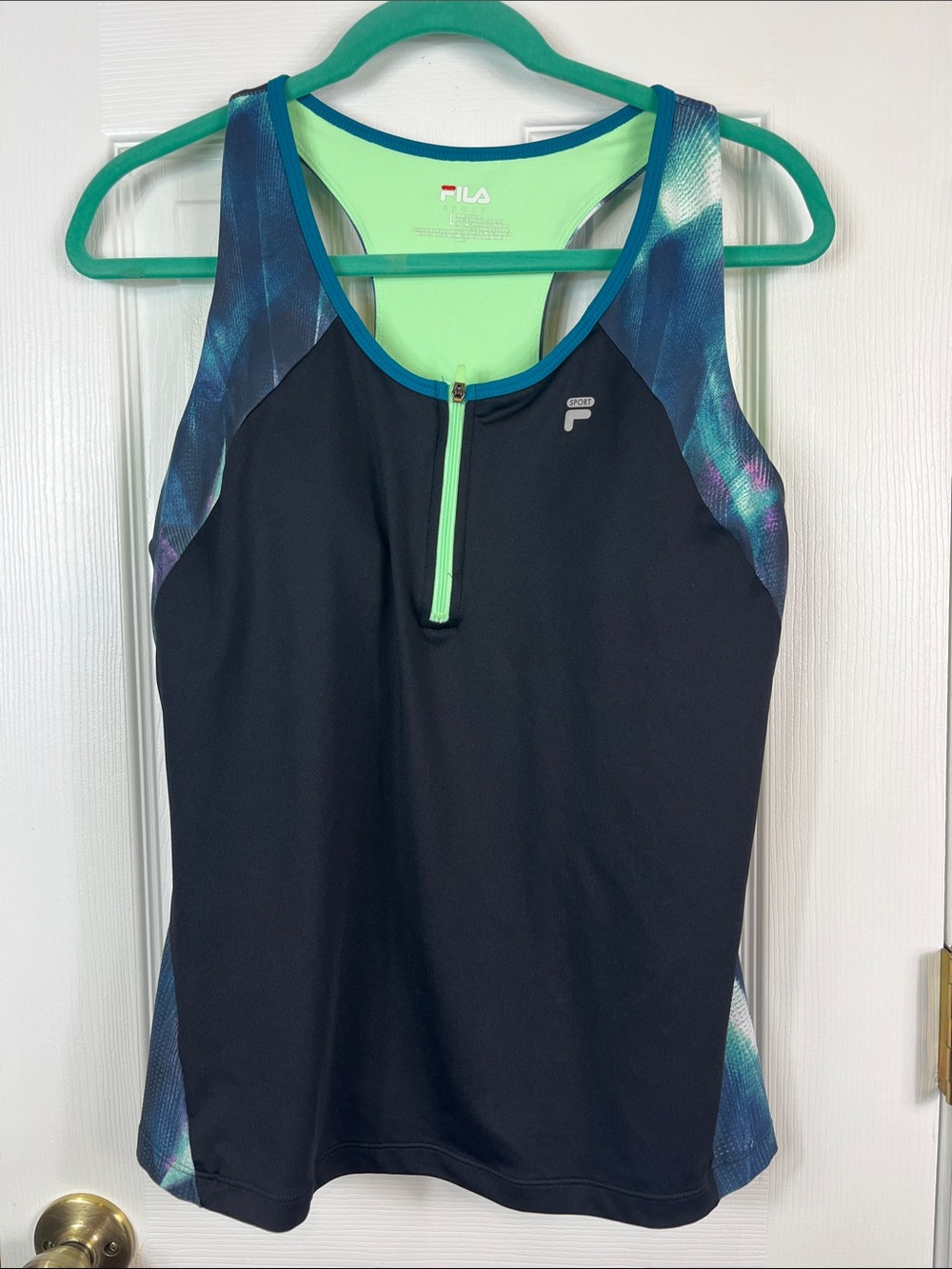 Fila black/lime detail workout top size large. Built in bra, 1/4 zip. Reverence.